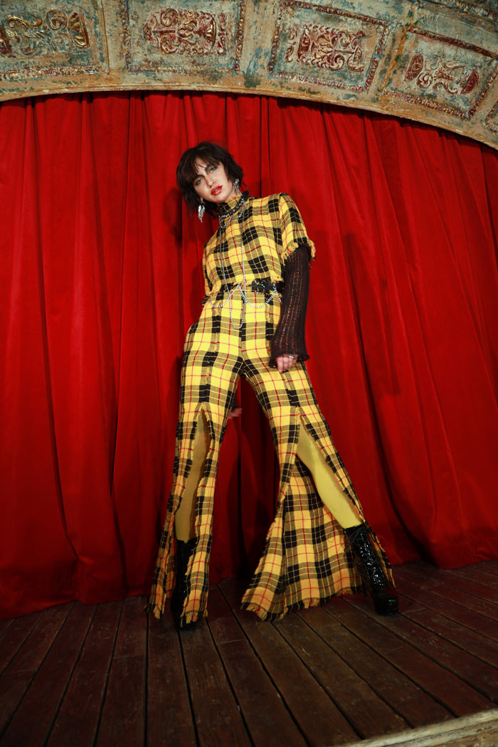 Vegan summer pant made from yellow/red tartan material, with two side slits on each side for a feminine look.